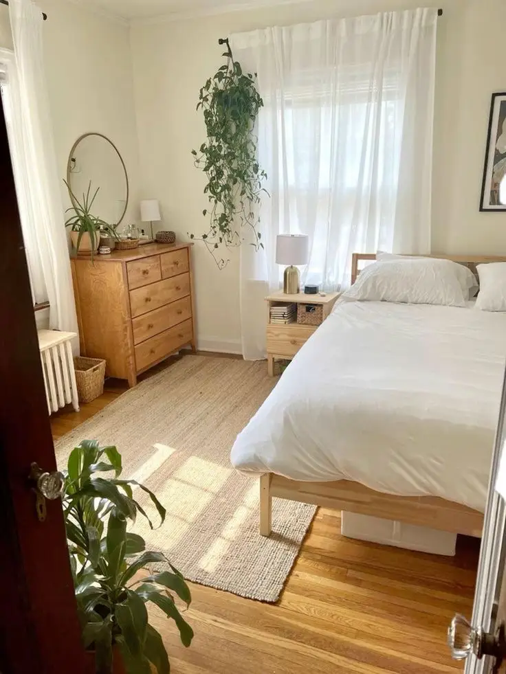 A plant adds some natural vibes to this bedroom